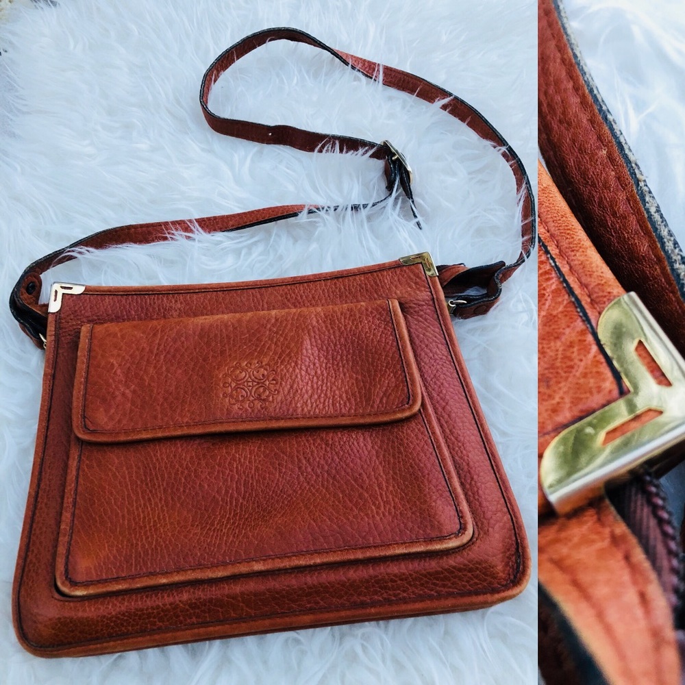 Hand-tooled vintage leather purse with gold accent